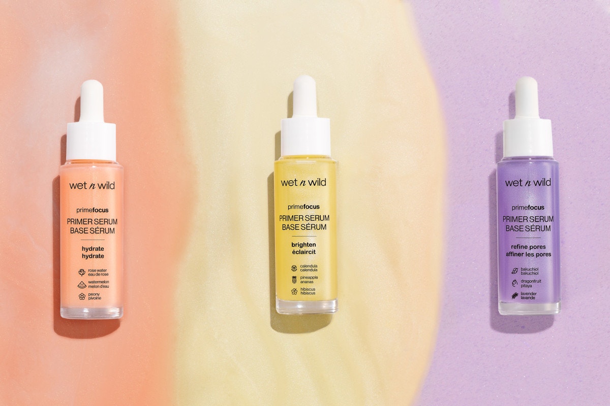 Wet n wild | Prime Focus Brightening Primer Serum | Product front facing lid closed, with colorful background